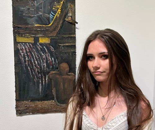 Aubrey with her artwork at the Phipps