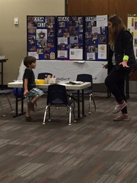 Teacher explaining the importance of Child Development Days to a student