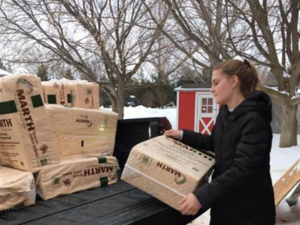student unloading truck
